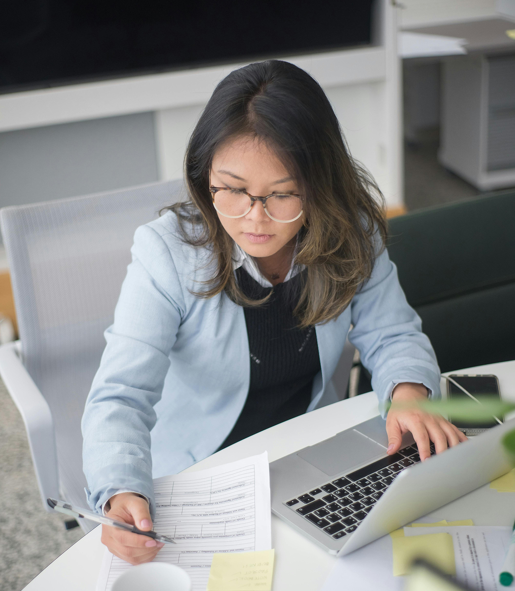 Offshore team members collaborating on a project in a modern office